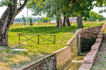 Country mill along dry river