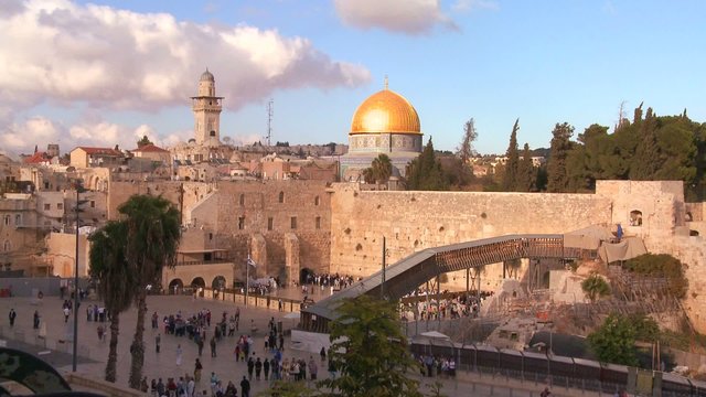 The Dome of the Rock towers over the Old City of Jerusalem and the Wailing Wall.