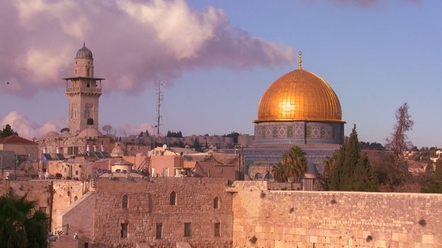 The Dome of the Rock towers over the Old City of Jerusalem and the Wailing Wall.