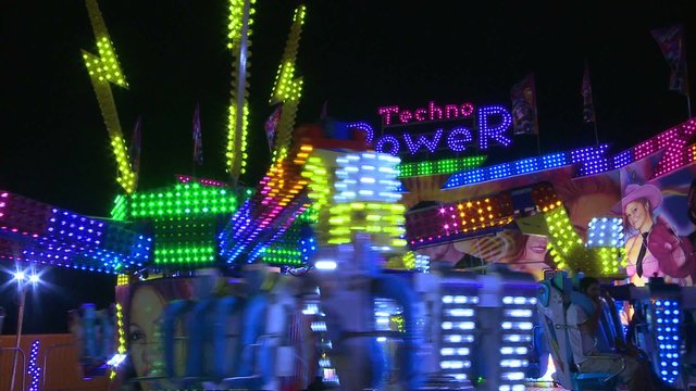 A ride at a carnival at night.