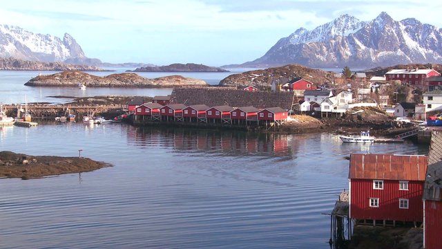 Fishing huts stand in rows in a village in the Arctic Lofoten Islands, Norway.