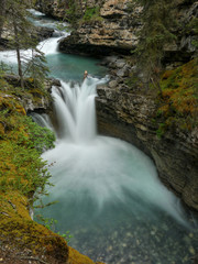 Fototapeta premium Waterfall into a wild gorge, Canadian Rockies