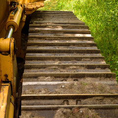 Crawler (continuous tracked tractor)  bulldozer track detail. © clubhousearts