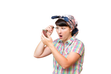 Housewife in a cloth dye eyelashes on white background