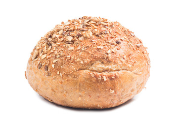 Fresh whole grain bread cut in half on white background
