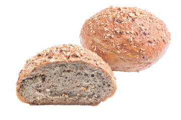 Fresh whole grain bread cut in half on white background
