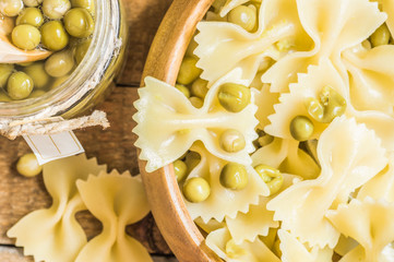 Farfalle pasta with green peas in a bowl