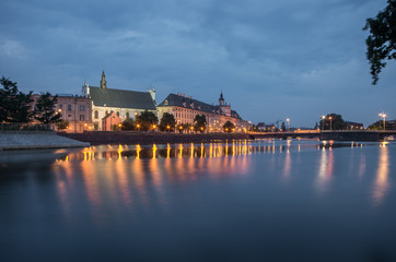 Odra river waterfront in Wroclaw, Poland, with university church and main university building, in early morning, seen from Malt Island (Wyspa Slodowa)