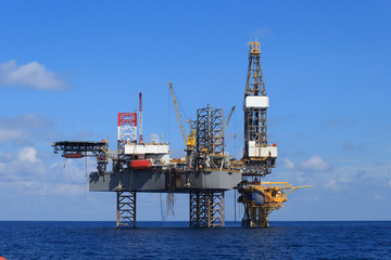 Offshore Jack Up Drilling Rig Over The Production Platform