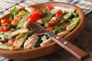 Chicken salad with avocado, arugula and tomato closeup. horizontal 
