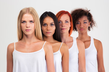 Fototapeta premium Portrait of a four serious multi ethnic women