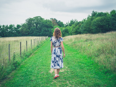 Young woman walking in the countryside