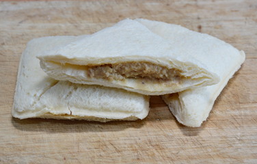 tuna sandwich cut on chop block