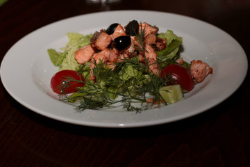 salad in a restaurant with fish