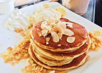 Layer of pancakes with almonds