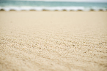 Fototapeta na wymiar Sandy beach background for summer. Sand texture. Macro shot.