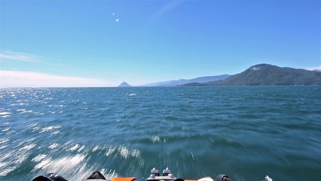 Point of view from a zodiac bow moving fast across the water near Puerto Raul Marin Balmaceda in Southern Chile.