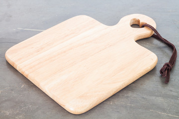 Wooden plate on grey background
