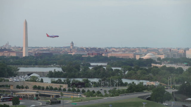 Washington DC cityscape and airplane flying on the sky, USA.