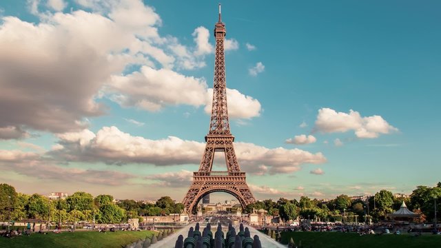 Eiffel Tower Timelapse, Trocadero, Paris: A timelapse of the Eiffel Tower from the garden of the Trocadero in a sunny summer evening with blue sky and puffy clouds. 0h20 Timelapse.