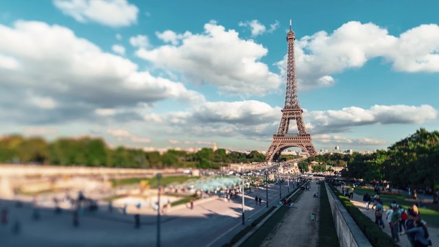 Eiffel Tower With Gardens Of The Trocadero, Paris: A Time Lapse (with a Tilt Shift lens) of the Eiffel Tower with the garden of the Trocadero in a sunny summer evening.