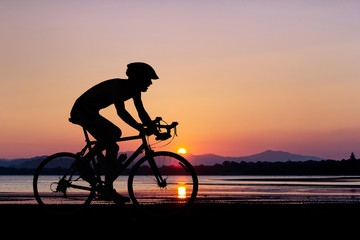 People cycling at beach