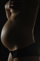 Naklejka premium pregnant with black background