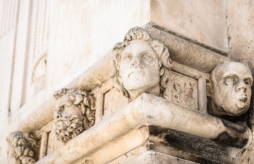 Sibenik Cathedral, Croatia.Human heads on the side portal of The Cathedral of St. James, Sibenik.