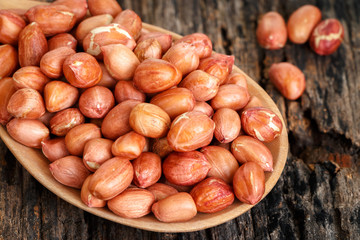 Peanuts on wooden table.