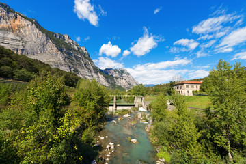 Fototapeta na wymiar Sarca River - Trentino Italy / The Sarca River with old dam in the Sarca Valley in Trentino Alto Adige, Italy, Europe