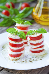 Traditional healthy sliced tomatoes with mozzarella salad