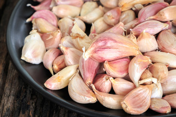 Garlic on old wooden background