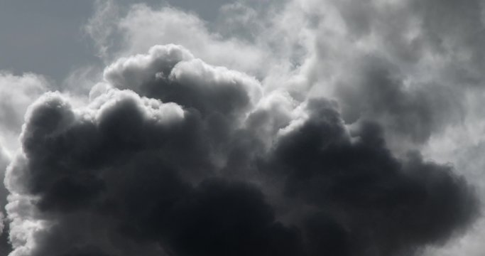 Time lapse of dark storm clouds billowing.