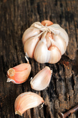 Garlic on old wooden background