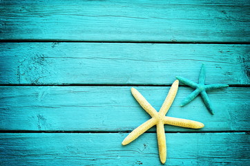 starfish on the blue wooden background