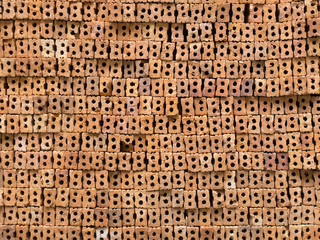 pile of thai red brick waiting for construction