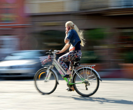 Girl cyclist in traffic
