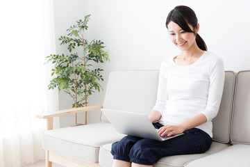 attractive asian woman using laptop