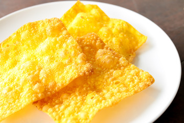 Fried dumpling in white plate.