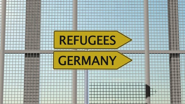 Refugees / Germany Signpost on border fence