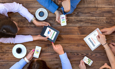 Business Team Interaction Top View of Arms of Group Young Business People Discussing Data on...