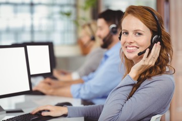 Portrait of young smiling female operator 