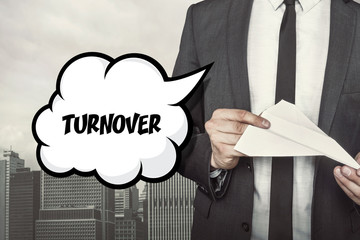Turnover text on speech bubble with businessman holding paper
