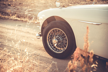Vintage car wheel at sunset - vintage effect