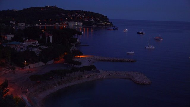 High angle over France's amazing Cote D'Azur at night.