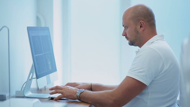 Dentist working on computer