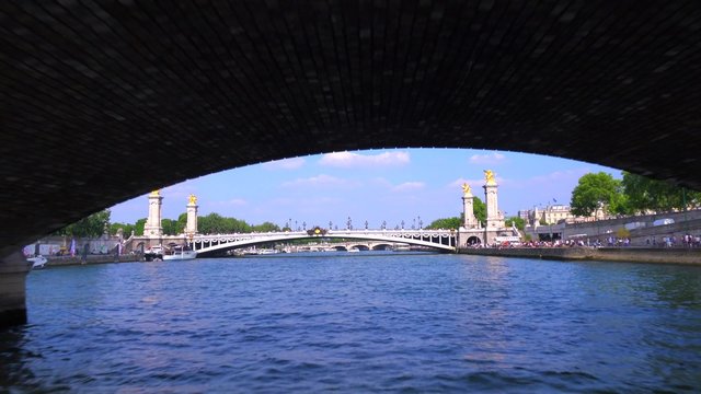 A point of view from a bateaux mouche riverboat along the Seine River in Paris.