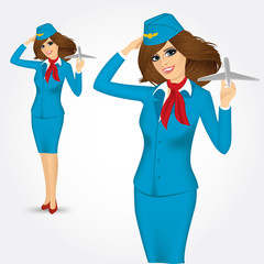 stewardess holding plane model and saluting