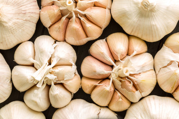 Garlic Background / Garlic / Garlic on Black Wooden Background