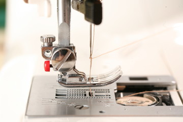 needle sewing machine and thread. work tailoring hobby